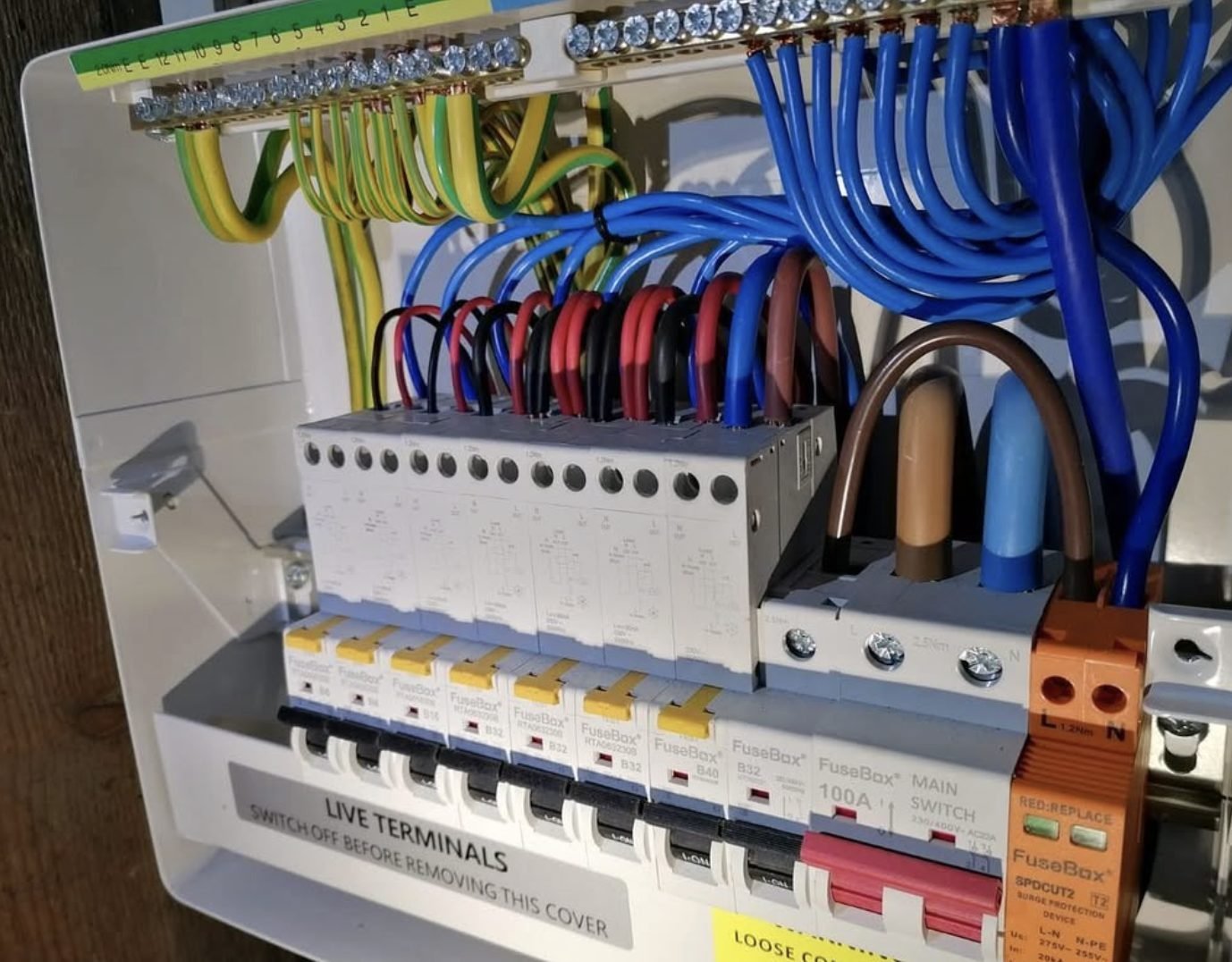 Close view of a finished consumer unit with dressed cabling